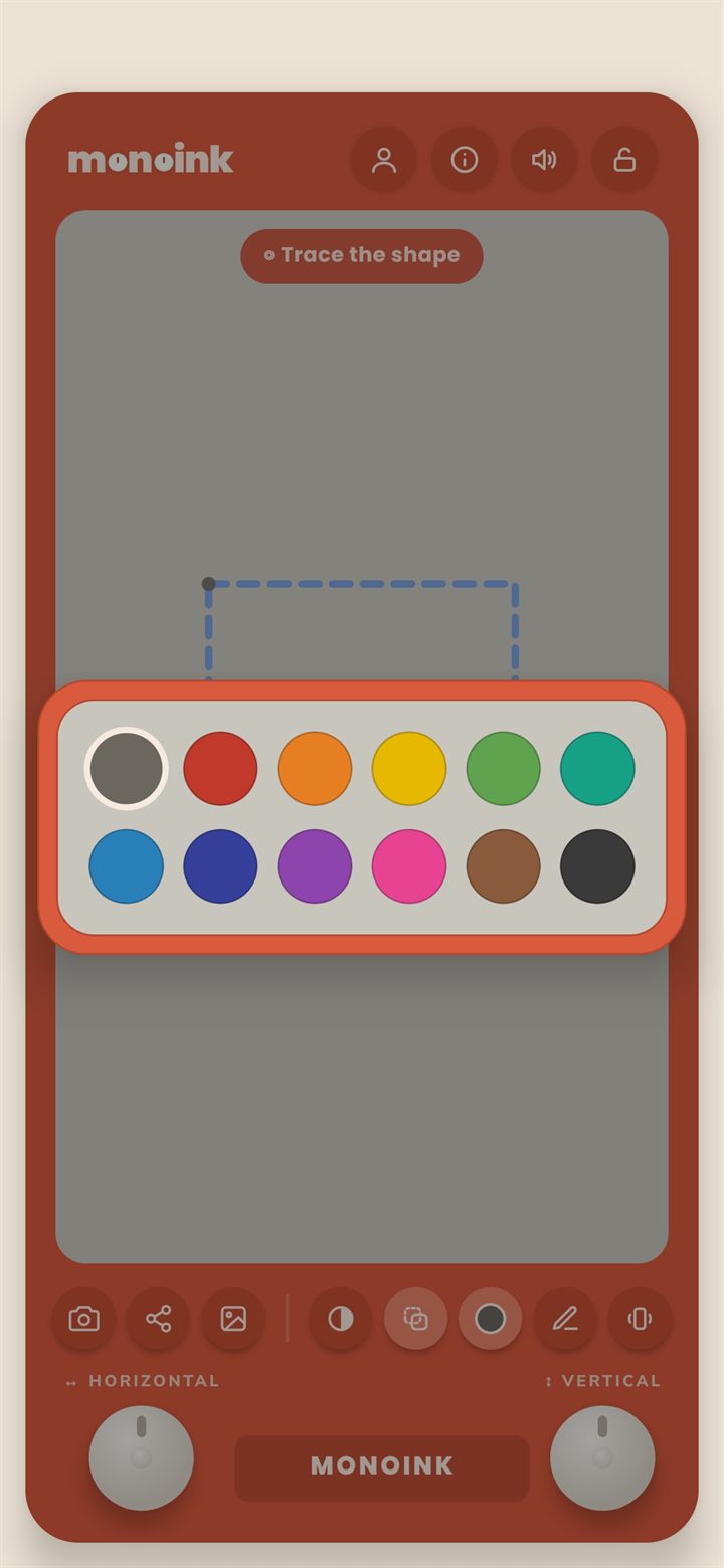 The monoink watercolour pen tray open over the board, showing twelve colour wells
